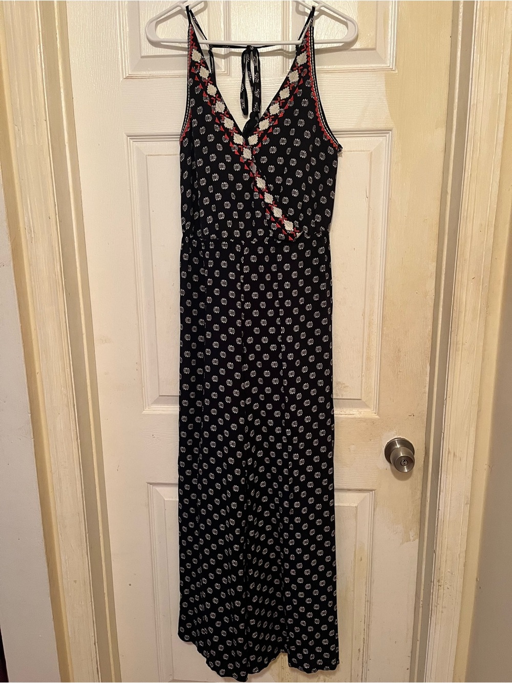 1 STATE Women’s Navy Jumpsuit with White Floral Motif and Orange Accents in XS.